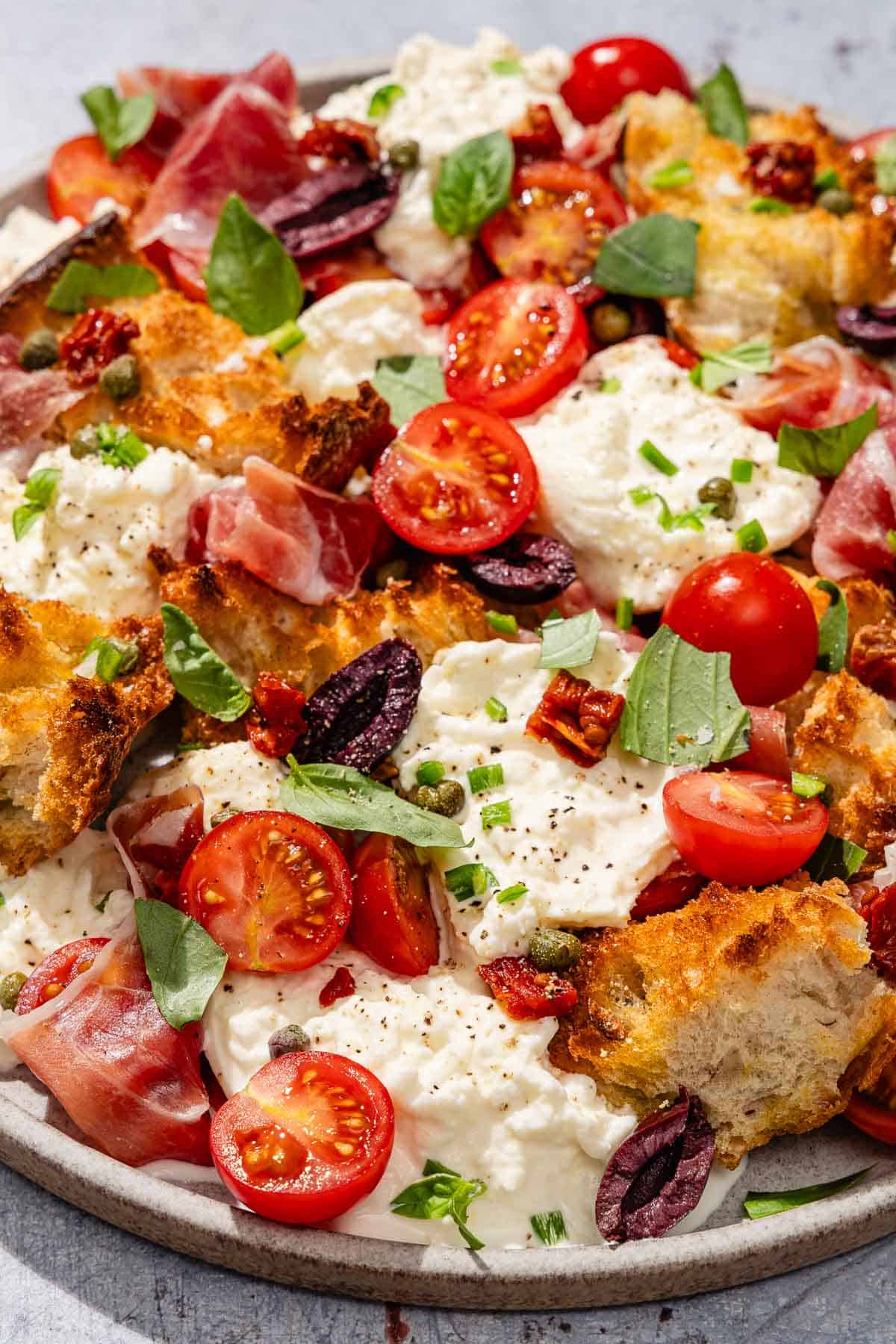 Burrata salad on a platter.