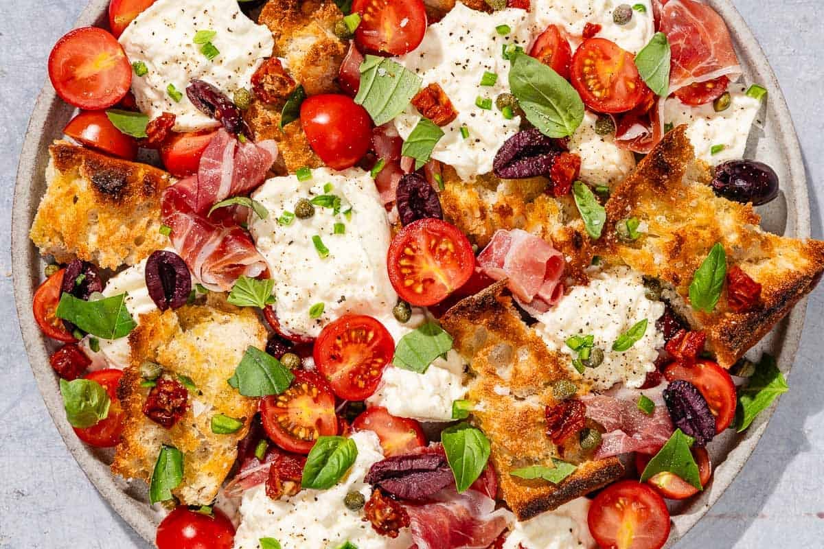 Burrata salad on a platter.