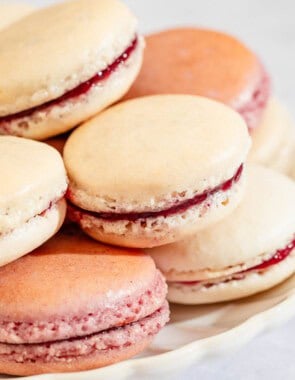 Several macarons stacked on a platter.