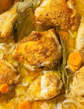 A close up of escabeche de pollo in a skillet.