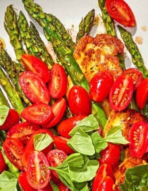 Roasted Asparagus Salad with Fried Halloumi and Fresh Tomatoes on a serving platter.